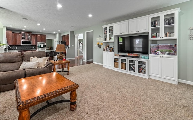 122 Brighton Ln, Adams Twp, PA 16046 - living room with recessed lighting, carpet flooring, baseboards, stairs, and a textured ceiling