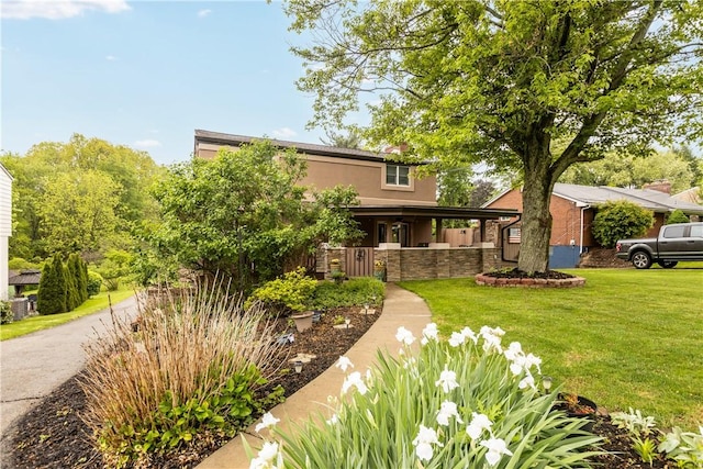 887 E Arcadia Dr, Mccandless, PA 15237 - view of front facade featuring a front yard, stone siding, and stucco siding