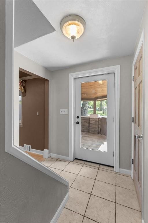 887 E Arcadia Dr, Mccandless, PA 15237 - doorway to outside with baseboards and light tile patterned floors
