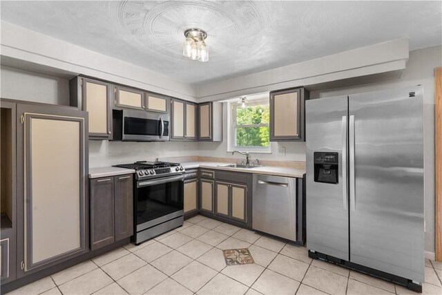 887 E Arcadia Dr, Mccandless, PA 15237 - kitchen with appliances with stainless steel finishes, light countertops, and light tile patterned floors