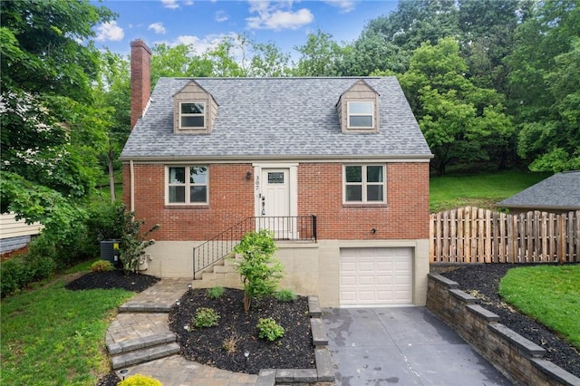 307 Schwartz Ave, Shaler, PA 15209 - cape cod-style house featuring brick siding, a chimney, concrete driveway, roof with shingles, and an attached garage