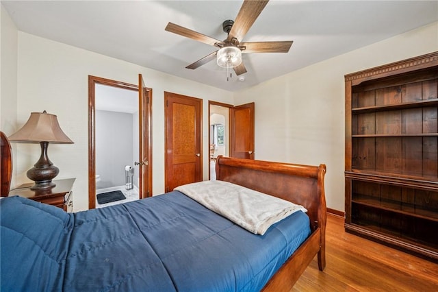 307 Schwartz Ave, Shaler, PA 15209 - bedroom with wood finished floors, ensuite bath, a ceiling fan, and baseboards
