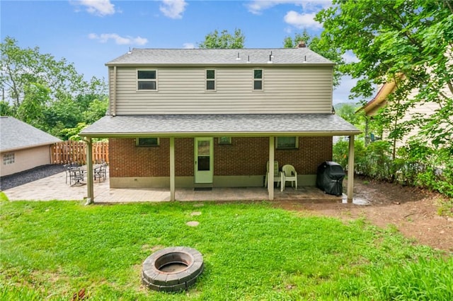 307 Schwartz Ave, Shaler, PA 15209 - back of property featuring a patio, brick siding, a fire pit, and roof with shingles