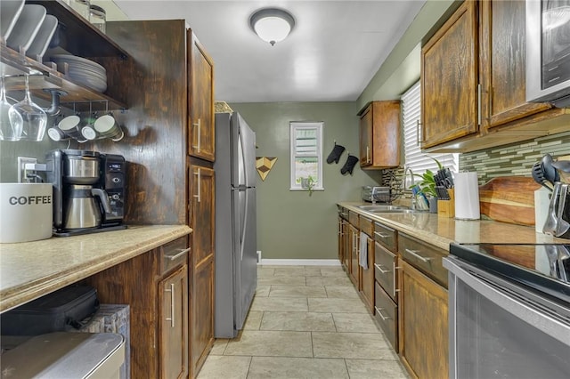1520 Worcester Dr, Pittsburgh, PA 15243 - kitchen with appliances with stainless steel finishes, open shelves, decorative backsplash, baseboards, and light countertops