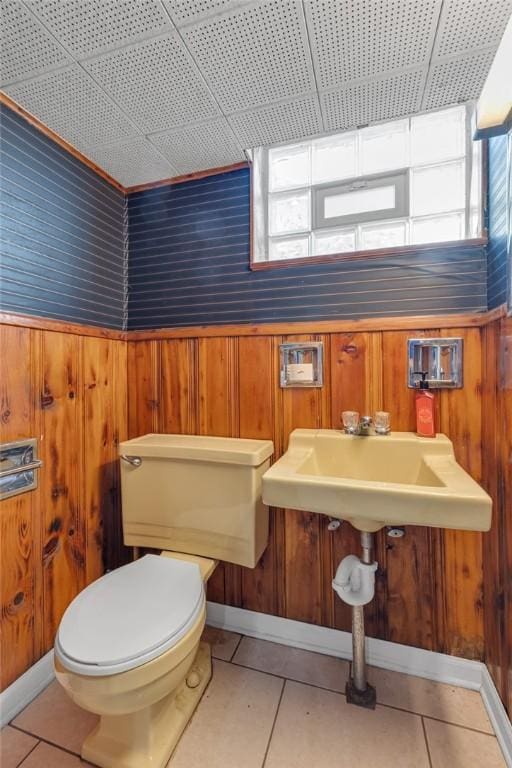 1520 Worcester Dr, Pittsburgh, PA 15243 - half bathroom with toilet, tile patterned flooring, and wooden walls