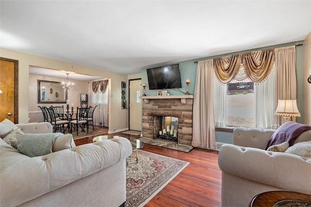 3500 Willett, Baldwin Boro, PA 15227 - living area featuring a chandelier, wood finished floors, and a stone fireplace