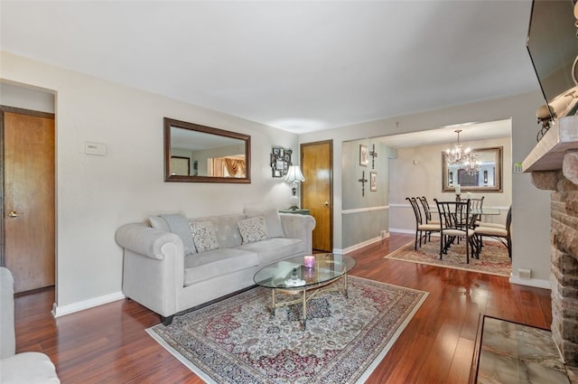 3500 Willett, Baldwin Boro, PA 15227 - living area featuring wood finished floors, a chandelier, and baseboards