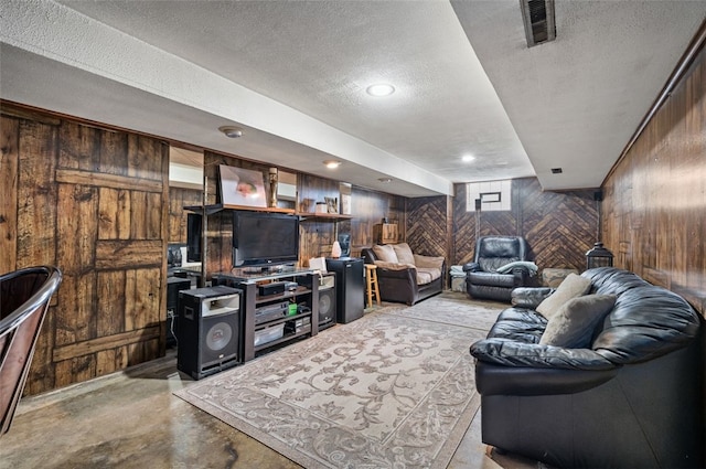 3500 Willett, Baldwin Boro, PA 15227 - living room with wooden walls, a textured ceiling, and concrete floors