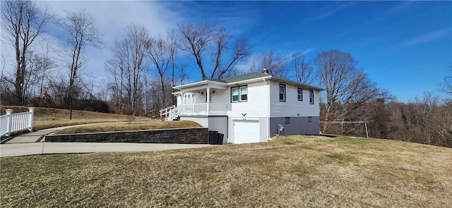 32 John Dr, Hanover Twp Wsh, PA 15021 - view of home's exterior featuring a garage, a yard, and a chimney