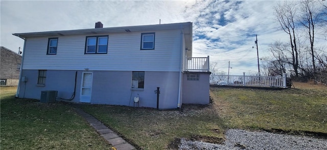 32 John Dr, Hanover Twp Wsh, PA 15021 - back of house with a lawn, central AC unit, and a chimney
