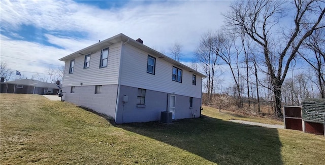 32 John Dr, Hanover Twp Wsh, PA 15021 - back of house with a yard, central air condition unit, and a chimney