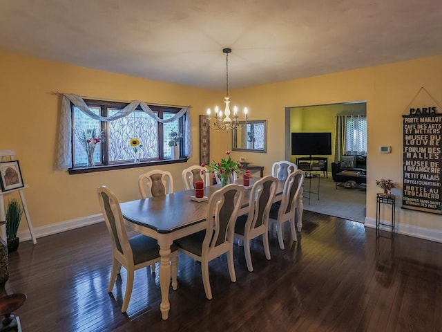 204 Biddle Ave, Regent Square, PA 15221 - dining space featuring a chandelier, dark wood-style floors, and baseboards