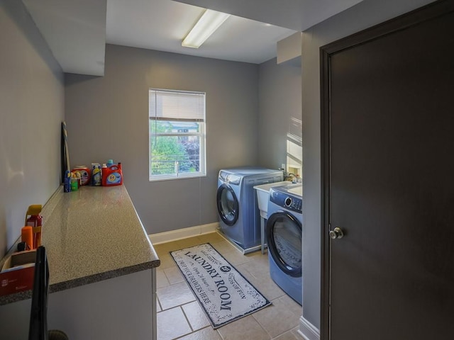 204 Biddle Ave, Regent Square, PA 15221 - laundry area featuring washing machine and dryer, light tile patterned floors, and baseboards