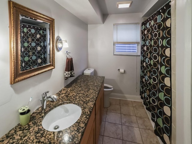204 Biddle Ave, Regent Square, PA 15221 - bathroom with toilet, vanity, baseboards, and tile patterned floors