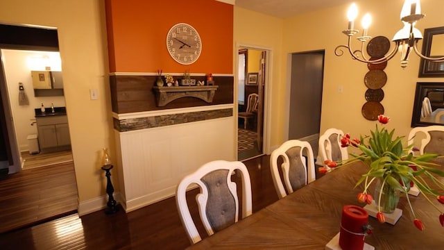 204 Biddle Ave, Regent Square, PA 15221 - dining room with wood finished floors, a chandelier, and baseboards