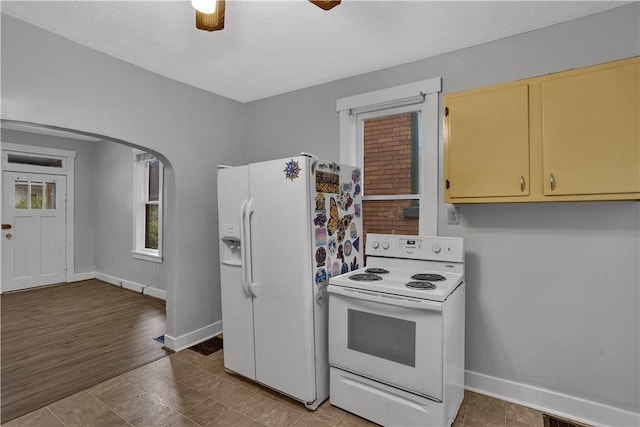 2914 5th Ave, Beaver Falls, PA 15010 - kitchen featuring white appliances, arched walkways, baseboards, a ceiling fan, and tile patterned flooring