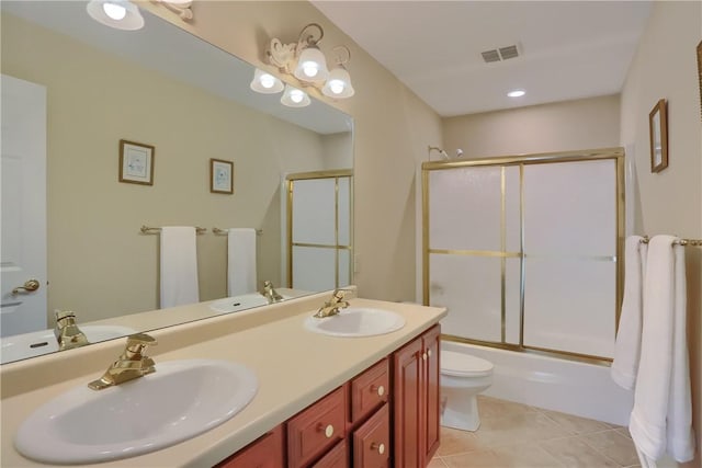 606 Adare Ct, Cranberry Twp, PA 16066 - bathroom featuring toilet, double vanity, enclosed tub / shower combo, and tile patterned floors