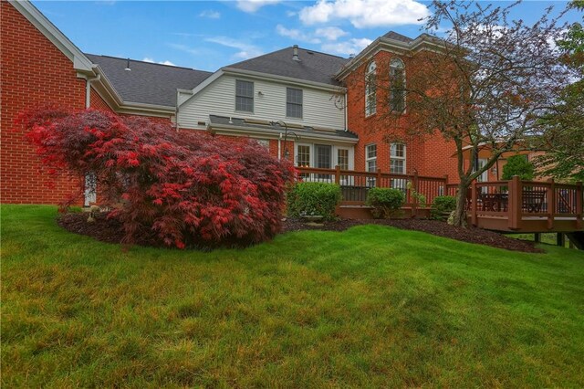 606 Adare Ct, Cranberry Twp, PA 16066 - rear view of property featuring a deck, a lawn, and brick siding