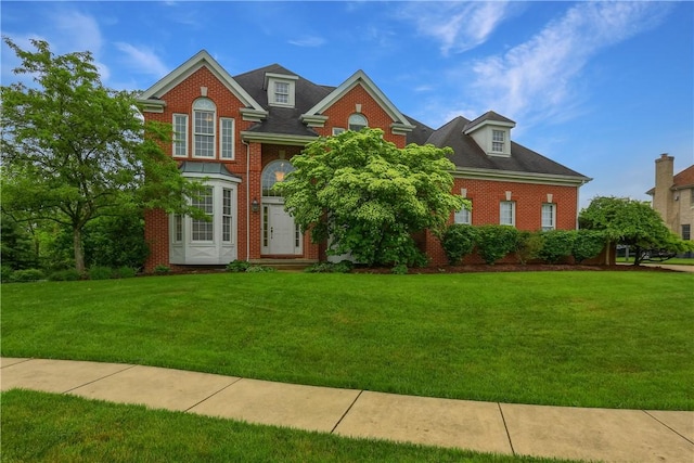 606 Adare Ct, Cranberry Twp, PA 16066 - georgian-style home with a front lawn and brick siding