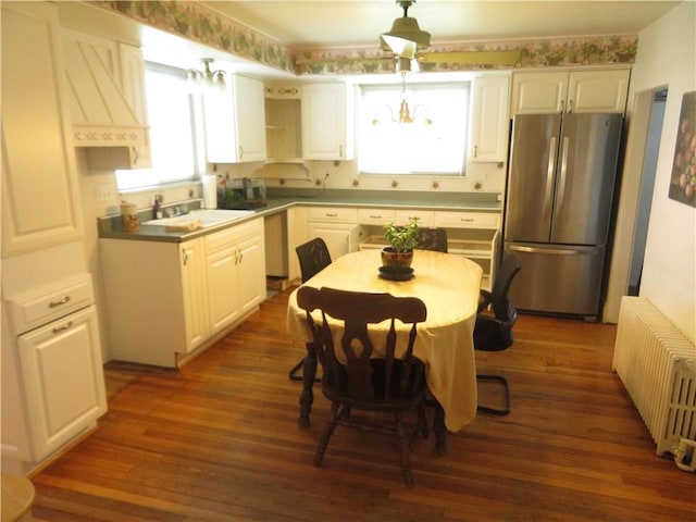 629 Freeport Rd, Jefferson Twp But, PA 16002 - kitchen featuring freestanding refrigerator, radiator, a sink, dark wood finished floors, and white cabinets