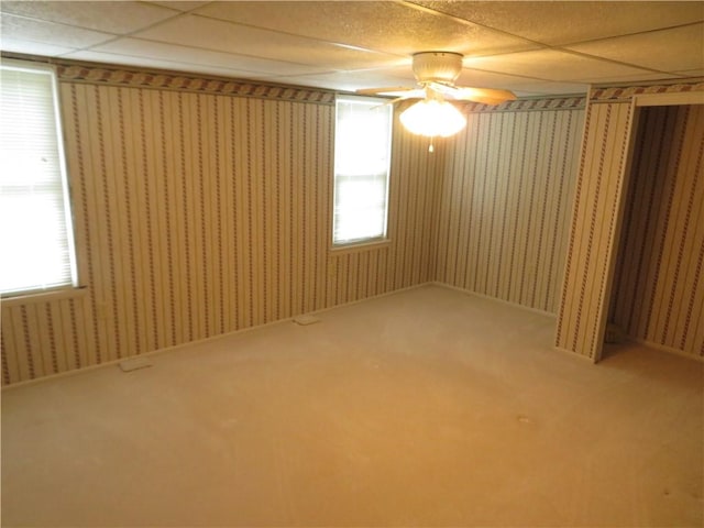 629 Freeport Rd, Jefferson Twp But, PA 16002 - unfurnished room with wallpapered walls, a ceiling fan, and a paneled ceiling