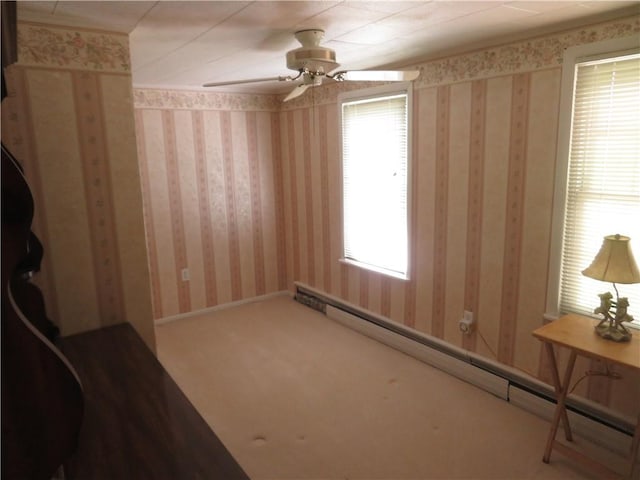 629 Freeport Rd, Jefferson Twp But, PA 16002 - spare room featuring a baseboard heating unit, a ceiling fan, and carpet floors