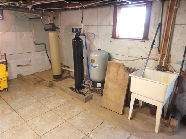 629 Freeport Rd, Jefferson Twp But, PA 16002 - below grade area featuring a water pressure tank, tile patterned flooring, and a water softener system