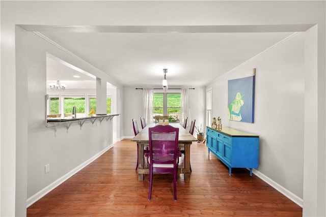 2507 Corteland Dr, Upper St Clair, PA 15241 - dining area featuring baseboards, crown molding, a chandelier, and wood finished floors