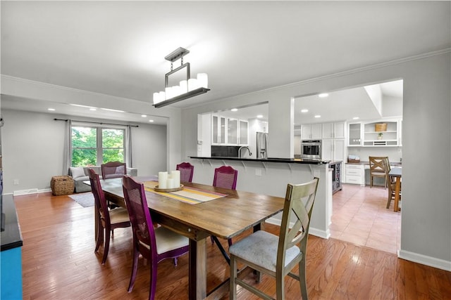 2507 Corteland Dr, Upper St Clair, PA 15241 - dining room featuring light wood finished floors, ornamental molding, beverage cooler, recessed lighting, and baseboards