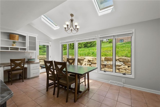 2507 Corteland Dr, Upper St Clair, PA 15241 - dining room featuring a skylight, lofted ceiling, light tile patterned floors, and a chandelier