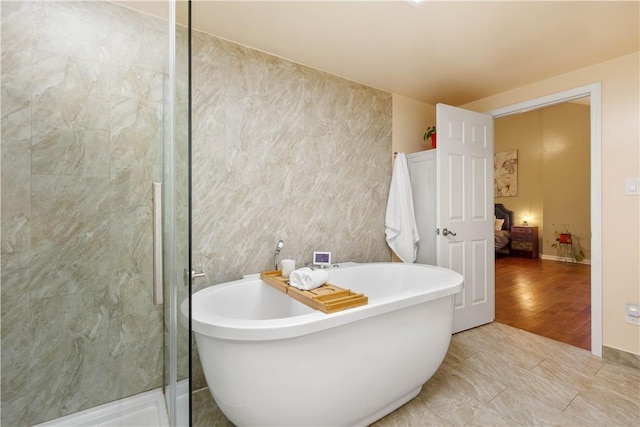 2507 Corteland Dr, Upper St Clair, PA 15241 - ensuite bathroom featuring a freestanding tub, a stall shower, and tile walls