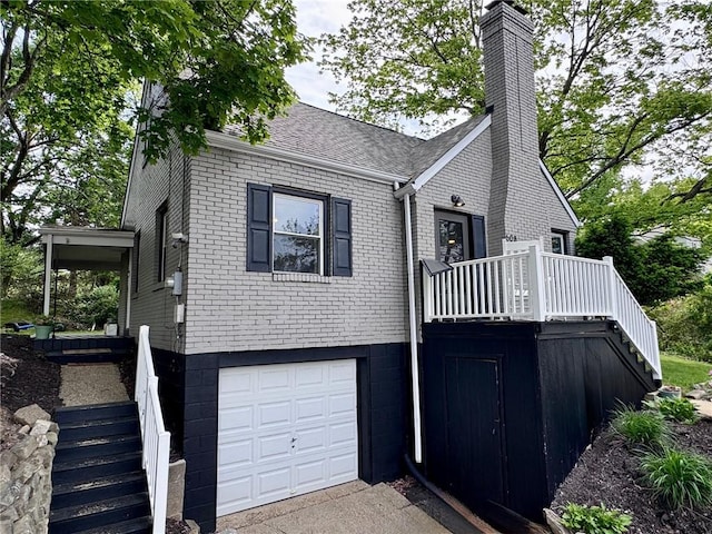 608 Wible Run Rd, Shaler, PA 15209 - view of front of property featuring stairs, brick siding, a chimney, and a garage