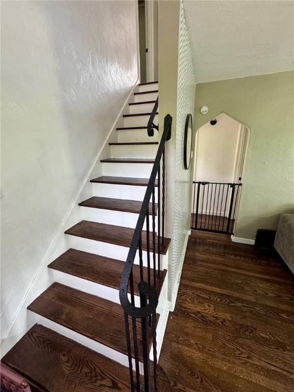 608 Wible Run Rd, Shaler, PA 15209 - stairs with wood finished floors and baseboards