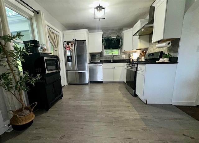 608 Wible Run Rd, Shaler, PA 15209 - kitchen with appliances with stainless steel finishes, wall chimney range hood, dark countertops, tasteful backsplash, and a sink