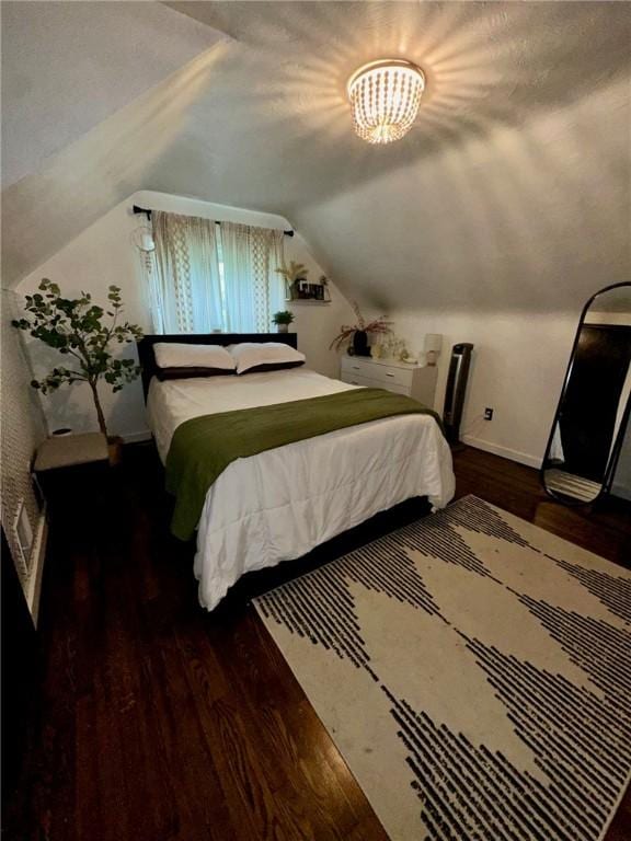 608 Wible Run Rd, Shaler, PA 15209 - bedroom with lofted ceiling, wood finished floors, and baseboards