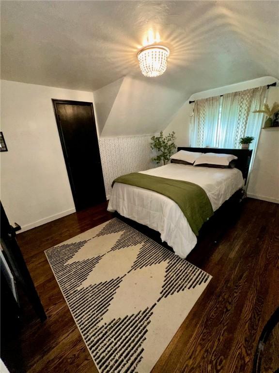 608 Wible Run Rd, Shaler, PA 15209 - bedroom featuring baseboards, wood finished floors, and lofted ceiling
