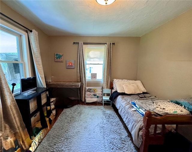 608 Wible Run Rd, Shaler, PA 15209 - bedroom featuring multiple windows and wood finished floors