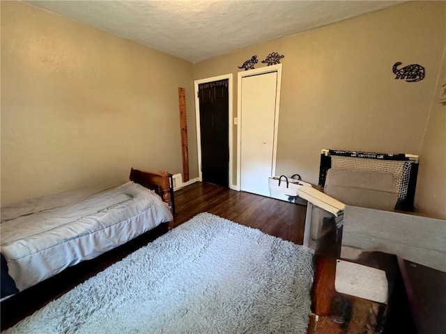 608 Wible Run Rd, Shaler, PA 15209 - bedroom featuring dark wood-style floors and a textured ceiling