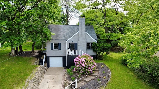 608 Wible Run Rd, Shaler, PA 15209 - view of front of home featuring an attached garage, concrete driveway, a front yard, a chimney, and brick siding