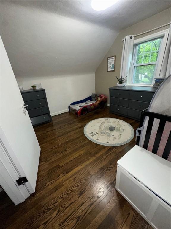 608 Wible Run Rd, Shaler, PA 15209 - bedroom with vaulted ceiling, wood finished floors, and baseboards