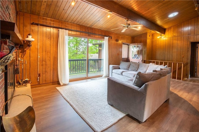 906 Aztec Trl, Coolspring Twp, PA 16137 - living area featuring wooden walls, wood finished floors, wooden ceiling, ceiling fan, and baseboards
