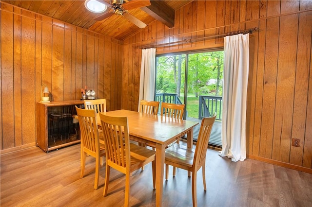 906 Aztec Trl, Coolspring Twp, PA 16137 - dining area with wooden walls, a ceiling fan, light wood-type flooring, baseboards, and wood ceiling