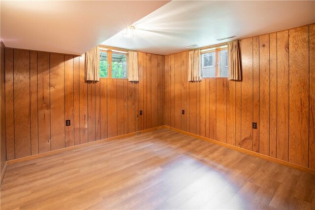 906 Aztec Trl, Coolspring Twp, PA 16137 - spare room featuring wood finished floors, plenty of natural light, wood walls, and baseboards