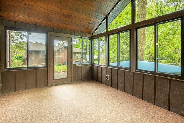 906 Aztec Trl, Coolspring Twp, PA 16137 - unfurnished sunroom with carpet flooring, wooden walls, and vaulted ceiling