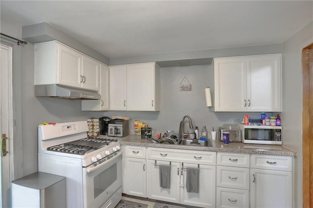 2 Sunnyside Dr, Braddock Hills, PA 15221 - kitchen with white gas range oven, under cabinet range hood, white cabinetry, a sink, and light countertops