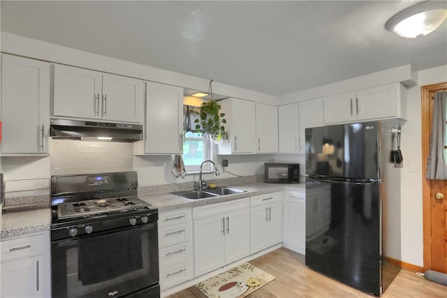 2 Sunnyside Dr, Braddock Hills, PA 15221 - kitchen featuring black appliances, under cabinet range hood, a sink, and white cabinets