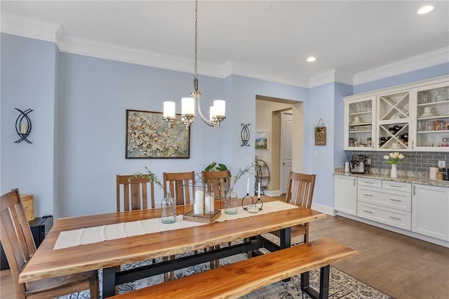 5525 Fontana Ct, Murrysville, PA 15632 - dining room featuring ornamental molding, dark wood-style floors, a chandelier, recessed lighting, and baseboards