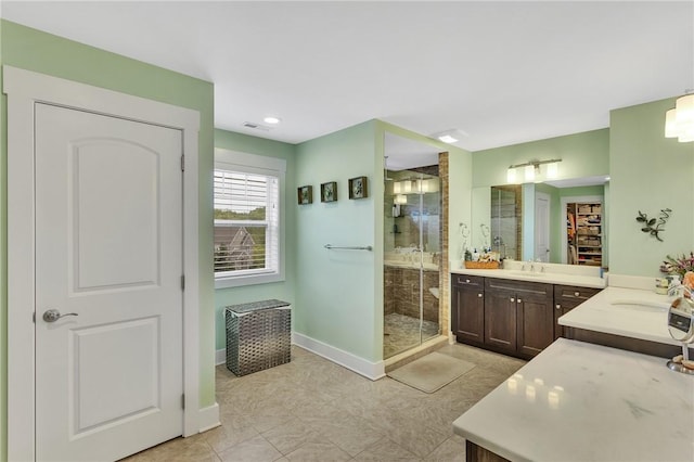 5525 Fontana Ct, Murrysville, PA 15632 - full bath with a shower stall, two vanities, baseboards, and a walk in closet