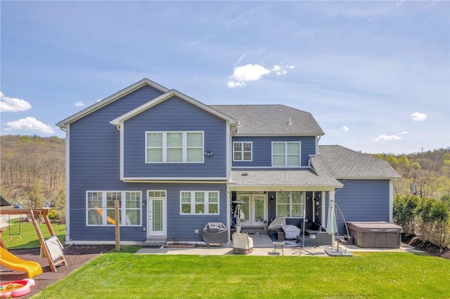 5525 Fontana Ct, Murrysville, PA 15632 - rear view of house featuring a hot tub, a patio area, a lawn, entry steps, and french doors