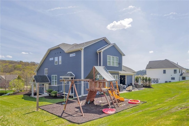 5525 Fontana Ct, Murrysville, PA 15632 - back of house with a playground and a lawn